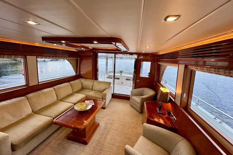 Slide: The Image of Luxurious interior of 2013 Hampton 620 Pilothouse yacht with elegant seating and waterfront views. - 12