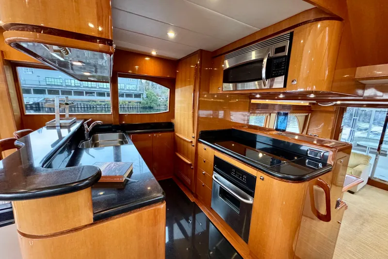 Slide: The Image of Luxurious kitchen interior of 2013 Hampton 620 Pilothouse yacht with modern appliances. - 14