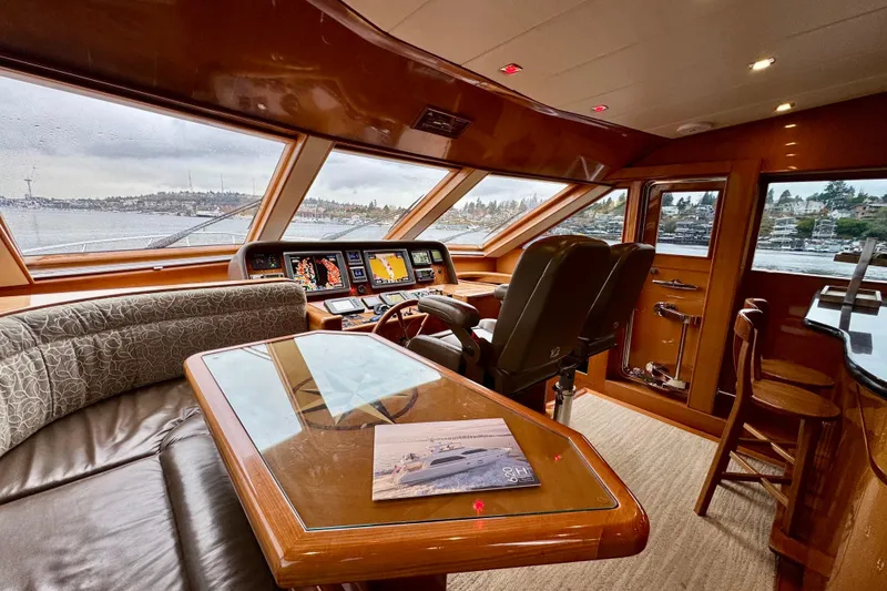 Slide: The Image of Pilothouse interior of 2013 Hampton 620 yacht with navigation equipment and seating. - 15