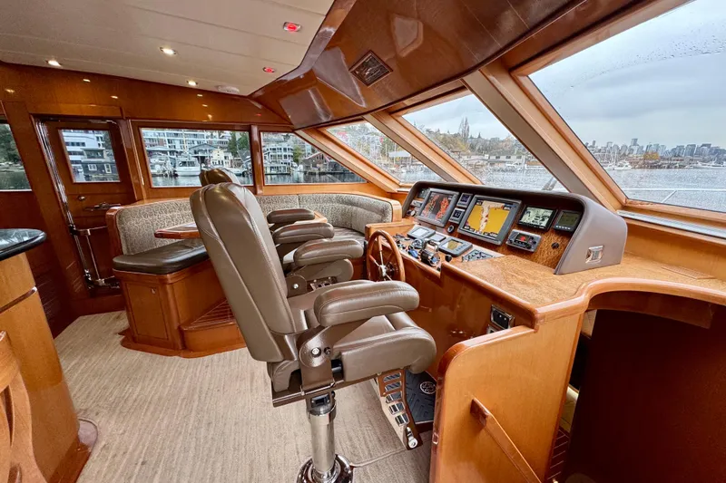 Slide: The Image of Luxurious 2013 Hampton 620 Pilothouse yacht interior with modern navigation equipment. - 17