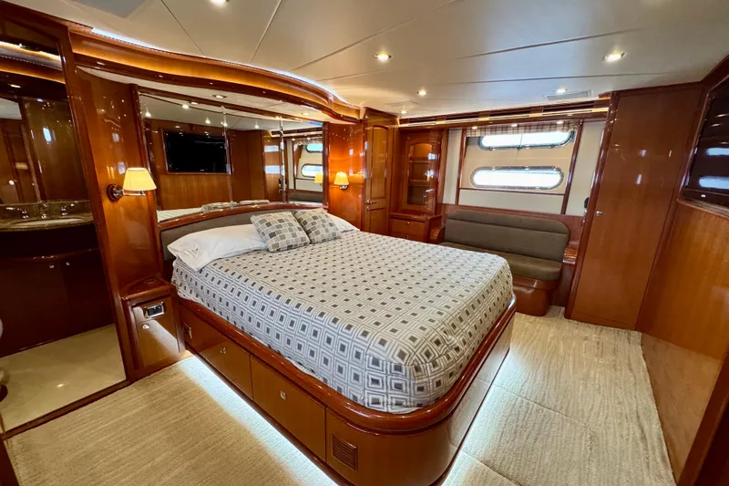 Slide: The Image of Luxurious bedroom interior of 2013 Hampton 620 Pilothouse yacht with elegant wood finishes. - 21