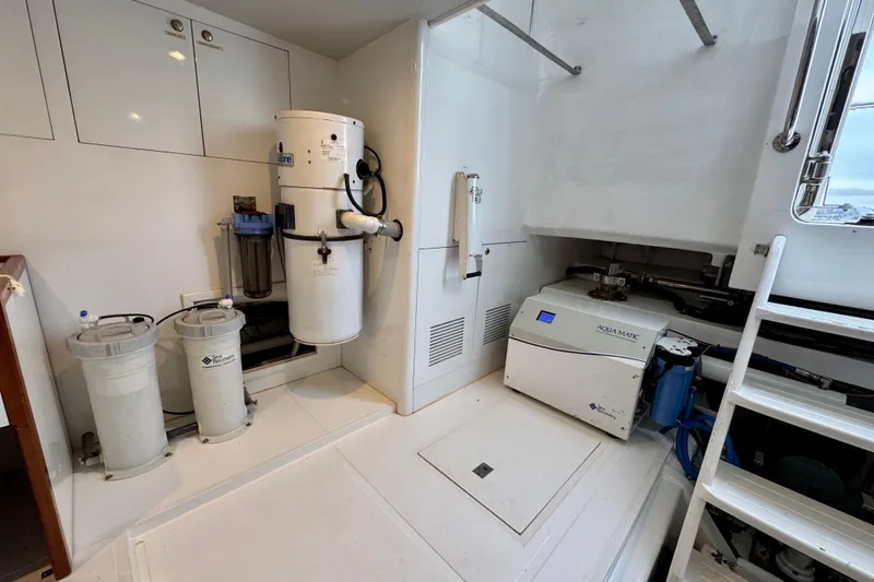 Slide: The Image of Engine room of 2013 Hampton 620 Pilothouse yacht with water filtration system. - 30