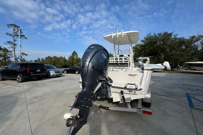 Slide: The Image of 2026 Sea Born LX21 Center Console boat with Yamaha outboard motor in parking lot. - 12
