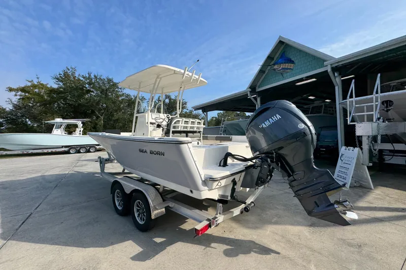 Slide: The Image of 2026 Sea Born LX21 Center Console boat with Yamaha outboard motor on trailer. - 15
