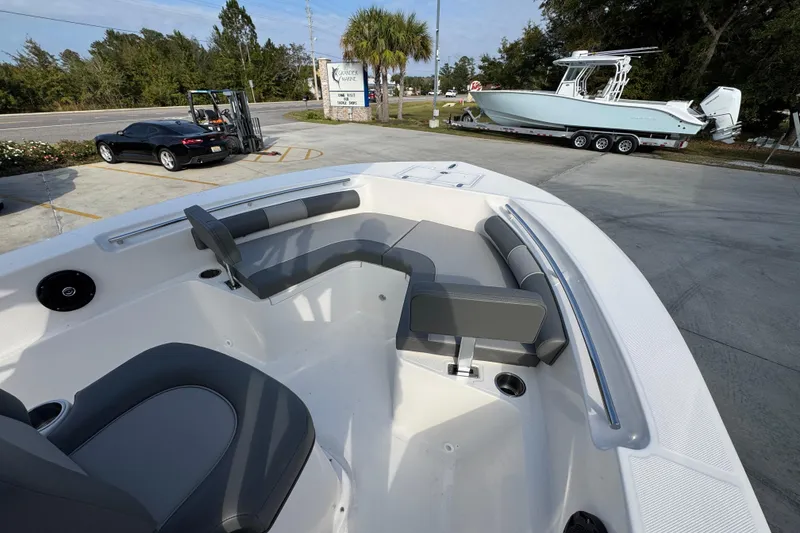 Slide: The Image of 2026 Sea Born LX21 Center Console boat interior with seating and cup holders. - 17