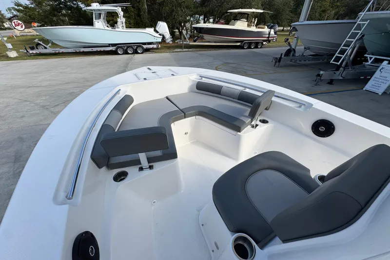 Slide: The Image of 2026 Sea Born LX21 Center Console boat interior with seating and cup holders. - 19