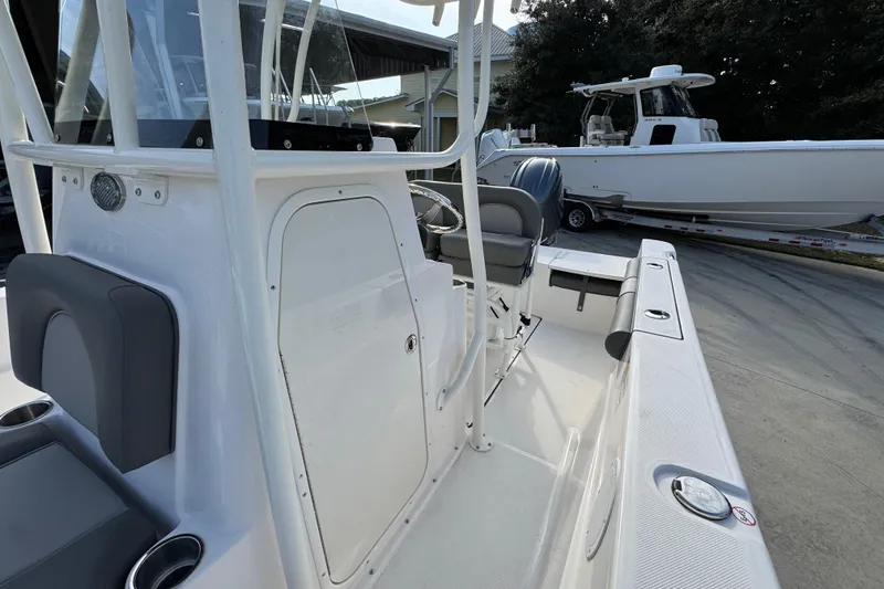 Slide: The Image of 2026 Sea Born LX21 Center Console boat interior with seating and console view. - 23