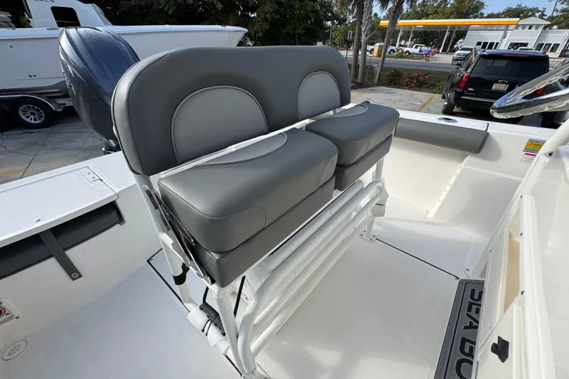 Slide: The Image of 2026 Sea Born LX21 Center Console boat with dual gray seats and steering wheel. - 34