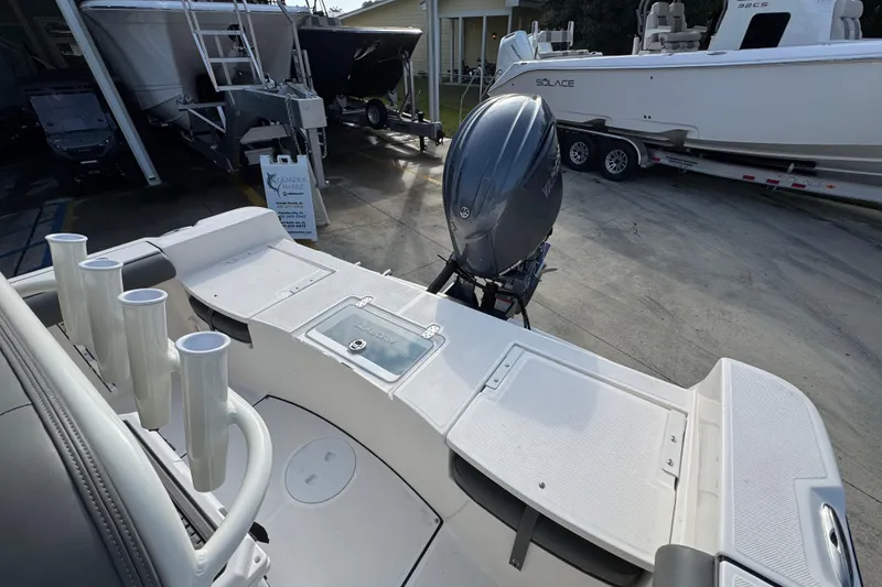 Slide: The Image of 2026 Sea Born LX21 Center Console boat with Yamaha outboard motor in a showroom. - 38