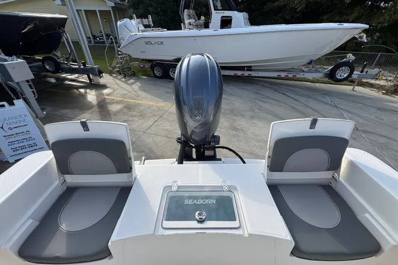Slide: The Image of 2026 Sea Born LX21 Center Console boat with engine, docked at marina. - 40
