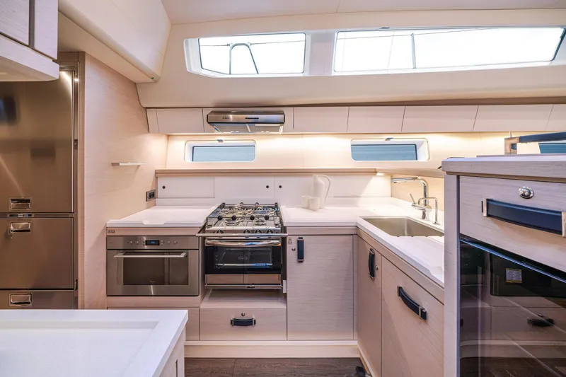 Slide: The Image of Modern kitchen interior of 2024 Jeanneau 65 yacht with sleek appliances and ample counter space. - 16