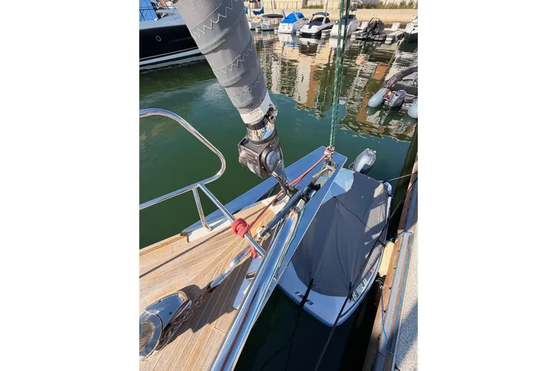 Slide: The Image of Beneteau Oceanis Yacht 60, 2015 model, docked with visible deck and rigging. - 13
