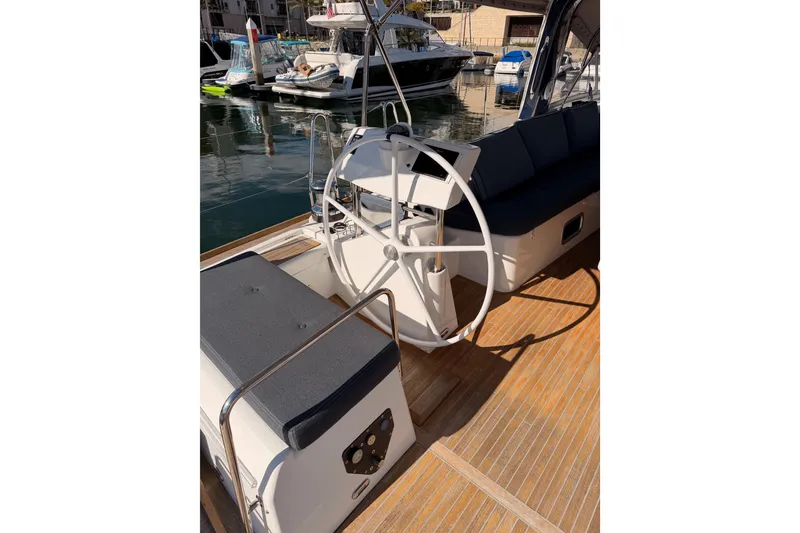 Slide: The Image of Beneteau Oceanis Yacht 60, 2015 model, featuring a sleek cockpit and steering wheel. - 27