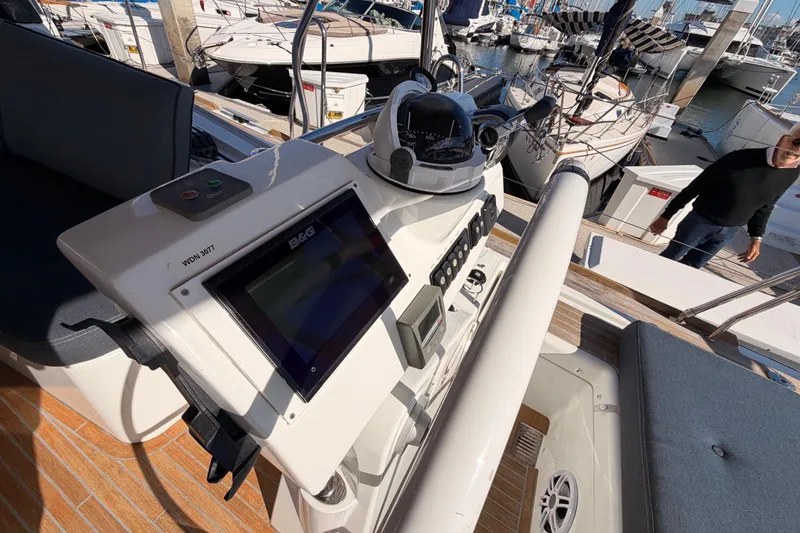 Slide: The Image of Cockpit of 2015 Beneteau Oceanis Yacht 60 with navigation equipment and seating. - 29