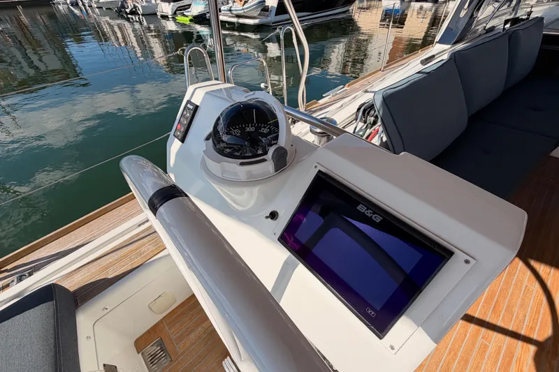 Slide: The Image of Beneteau Oceanis Yacht 60 cockpit with navigation instruments, docked in a marina, 2015 model. - 32