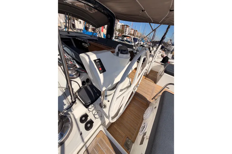 Slide: The Image of Beneteau Oceanis Yacht 60 cockpit, 2015 model, featuring dual steering wheels and modern navigation equipment. - 33
