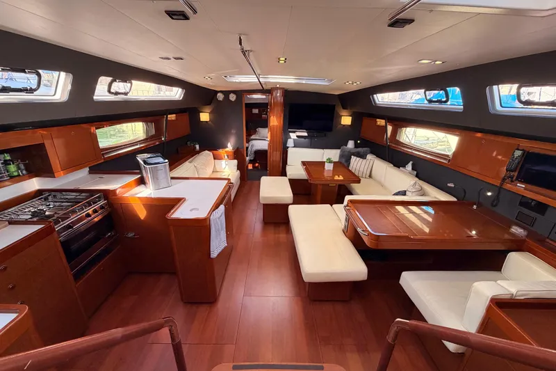 Slide: The Image of Luxurious interior of 2015 Beneteau Oceanis Yacht 60 with elegant wood finishes and spacious seating. - 37