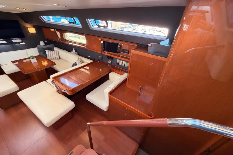 Slide: The Image of Luxurious interior of 2015 Beneteau Oceanis Yacht 60 with elegant wood finish and plush seating. - 39