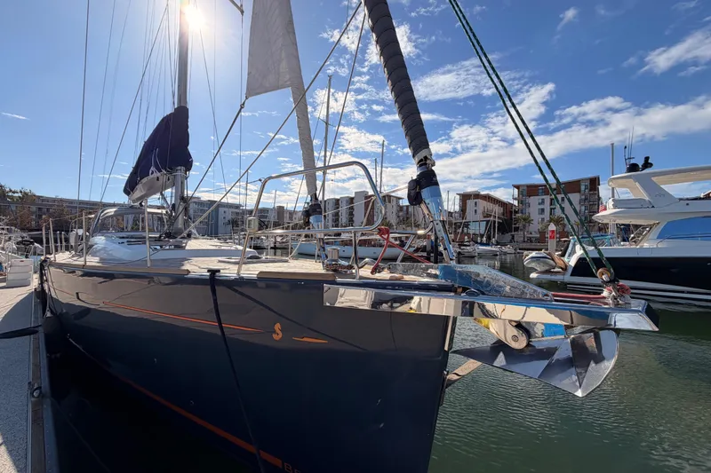 Slide: The Image of Beneteau Oceanis Yacht 60, 2015 model, docked in a sunny marina. - 4