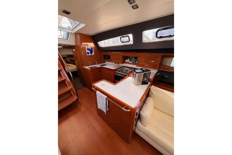 Slide: The Image of Luxurious interior of 2015 Beneteau Oceanis Yacht 60 with modern kitchen amenities. - 41
