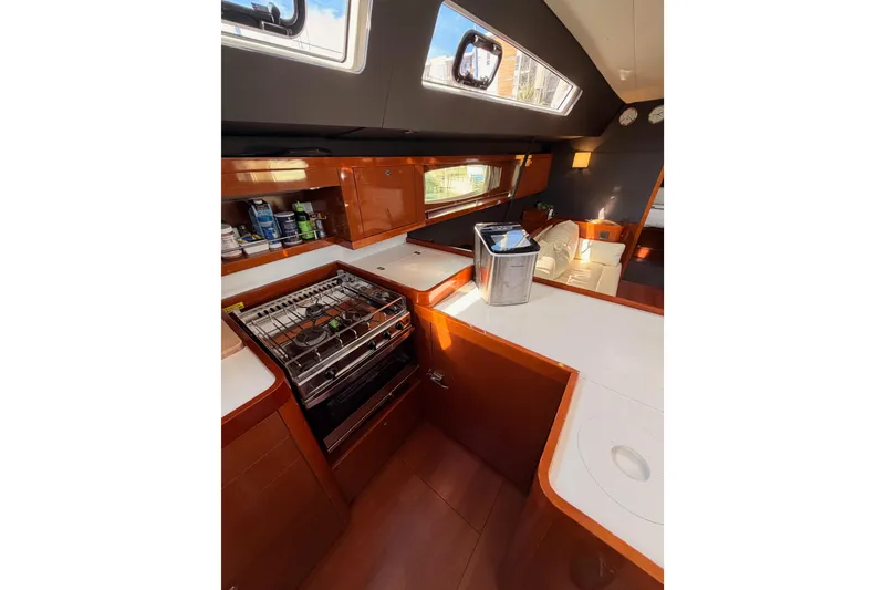 Slide: The Image of Luxurious interior of 2015 Beneteau Oceanis Yacht 60, featuring modern kitchen and seating area. - 42