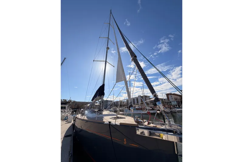 Slide: The Image of 2015 Beneteau Oceanis Yacht 60 docked under clear blue sky. - 5