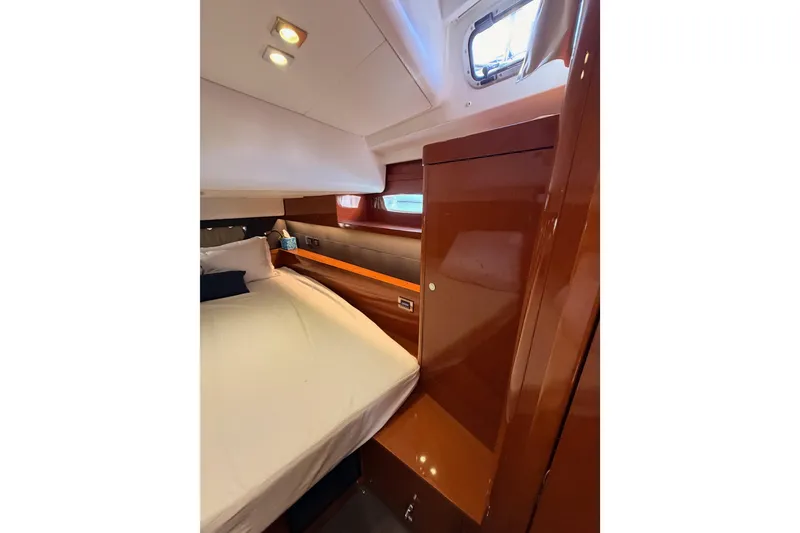 Slide: The Image of Luxurious cabin interior of 2015 Beneteau Oceanis Yacht 60 with elegant wood finish. - 52