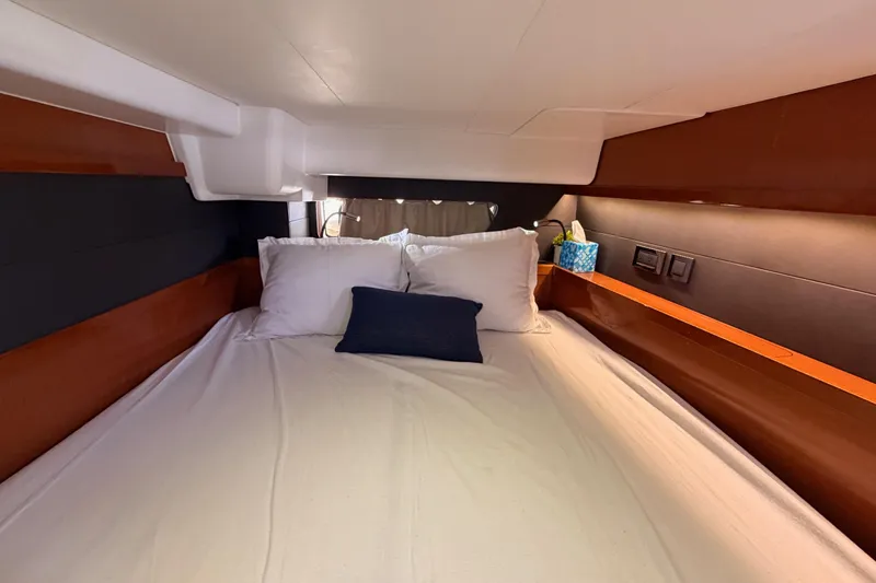 Slide: The Image of Luxurious cabin interior of 2015 Beneteau Oceanis Yacht 60 with cozy bedding. - 53