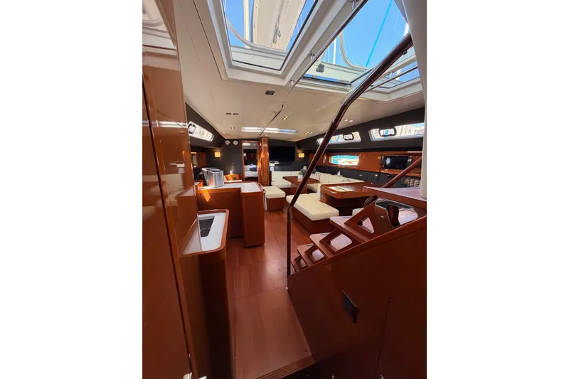 Slide: The Image of Luxurious interior of 2015 Beneteau Oceanis Yacht 60 with elegant wood finishes. - 58
