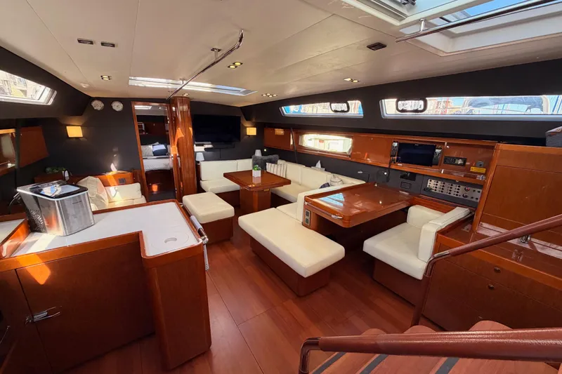 Slide: The Image of Luxurious interior of 2015 Beneteau Oceanis Yacht 60 with elegant wood and white seating. - 59