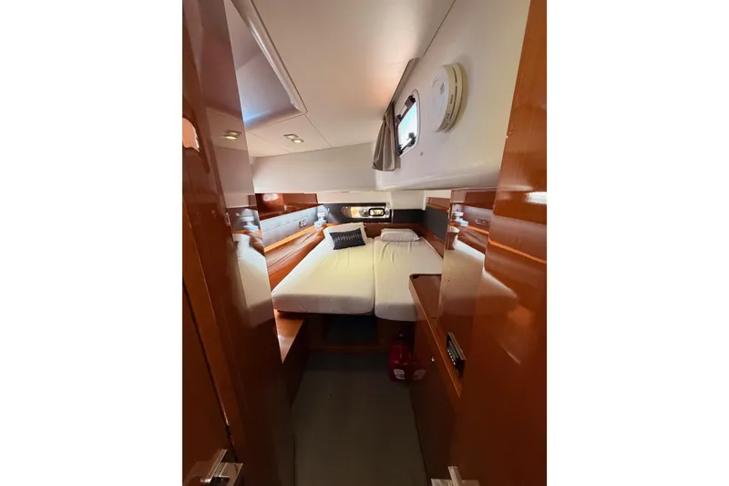 Slide: The Image of Luxurious cabin interior of 2015 Beneteau Oceanis Yacht 60 with elegant wood finish. - 62