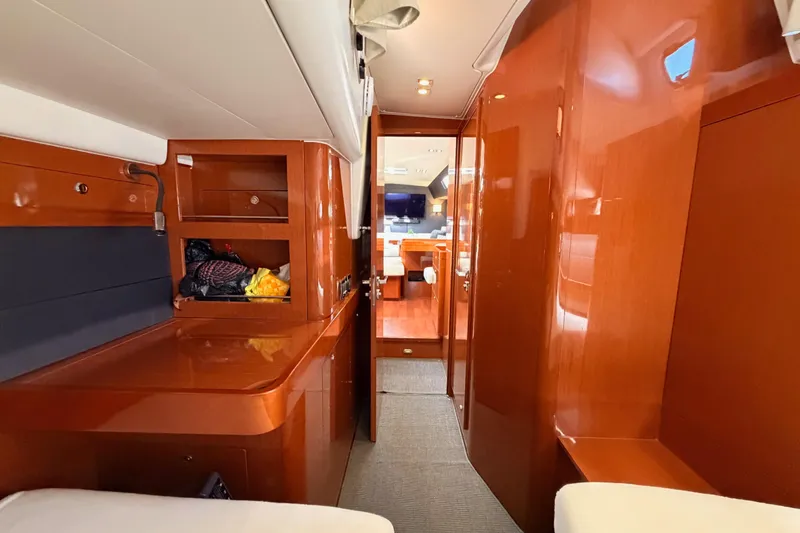 Slide: The Image of Luxurious interior of 2015 Beneteau Oceanis Yacht 60, featuring polished wood finishes. - 65