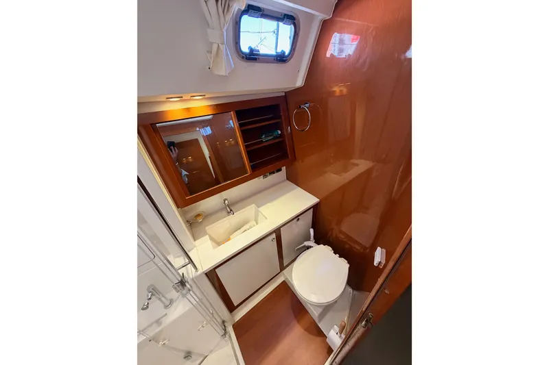 Slide: The Image of Luxurious bathroom in 2015 Beneteau Oceanis Yacht 60, featuring modern fixtures and wood accents. - 67