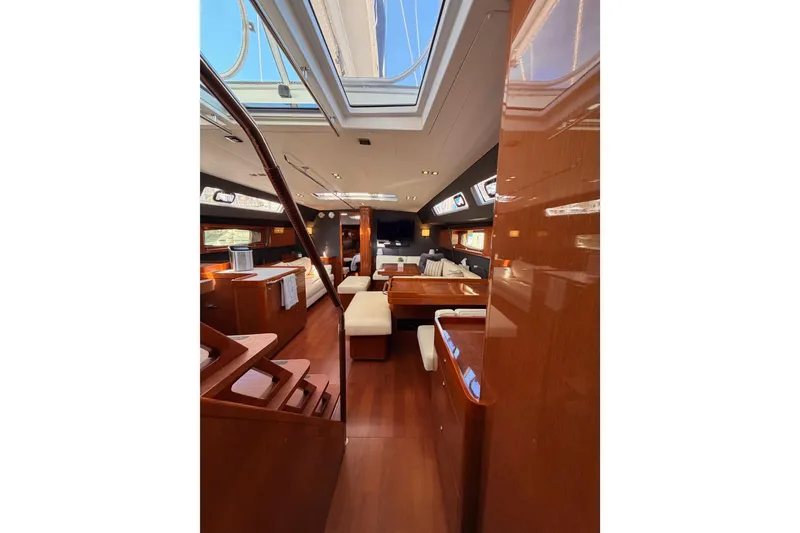 Slide: The Image of Luxurious interior of 2015 Beneteau Oceanis Yacht 60 with elegant wood finishes and spacious layout. - 68