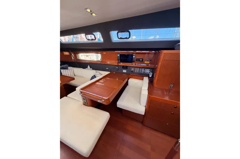 Slide: The Image of Luxurious interior of 2015 Beneteau Oceanis Yacht 60 with elegant seating and navigation area. - 69