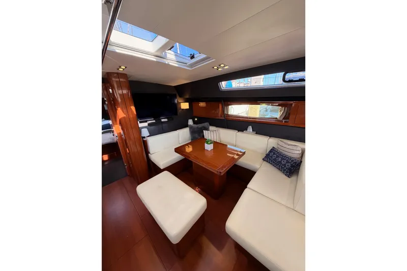 Slide: The Image of Luxurious interior of 2015 Beneteau Oceanis Yacht 60 with elegant seating and skylight. - 74