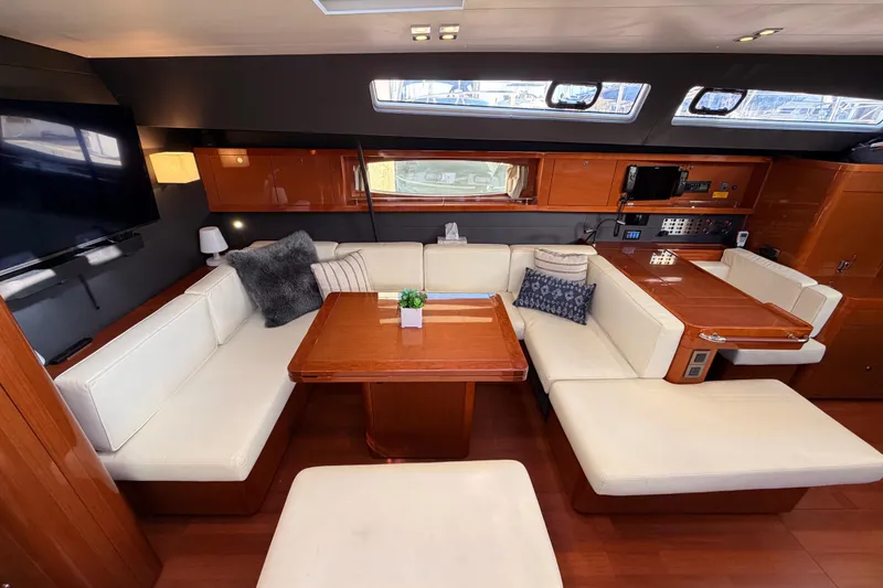 Slide: The Image of Luxurious interior of 2015 Beneteau Oceanis Yacht 60 with elegant seating and wooden finishes. - 75