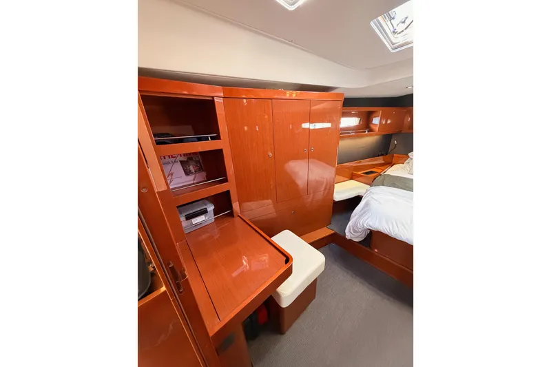 Slide: The Image of Luxurious cabin interior of 2015 Beneteau Oceanis Yacht 60 with wooden furnishings. - 82