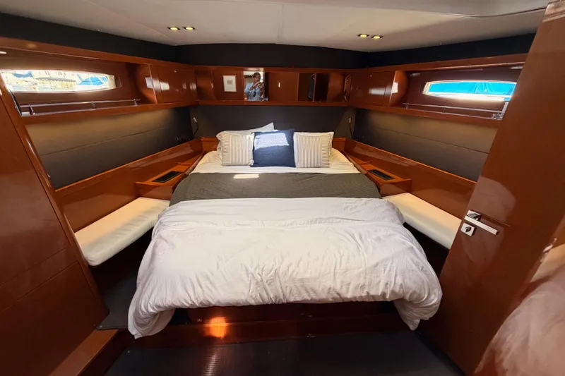 Slide: The Image of Luxurious cabin interior of 2015 Beneteau Oceanis Yacht 60 with cozy bedding. - 83