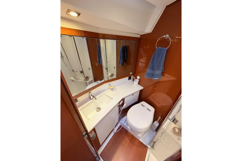Slide: The Image of Luxurious bathroom in 2015 Beneteau Oceanis Yacht 60, featuring modern fixtures and elegant wood finishes. - 85