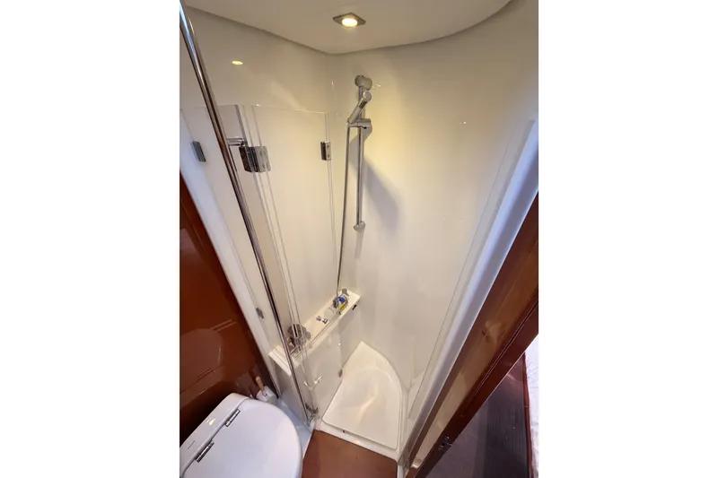 Slide: The Image of Compact shower area in 2015 Beneteau Oceanis Yacht 60, featuring modern fixtures and sleek design. - 86