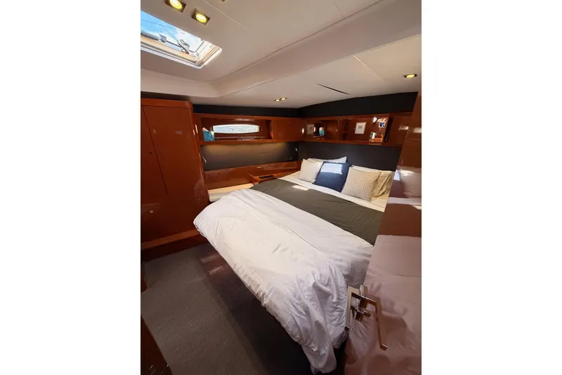 Slide: The Image of Luxurious cabin interior of 2015 Beneteau Oceanis Yacht 60 with elegant wood finish. - 88