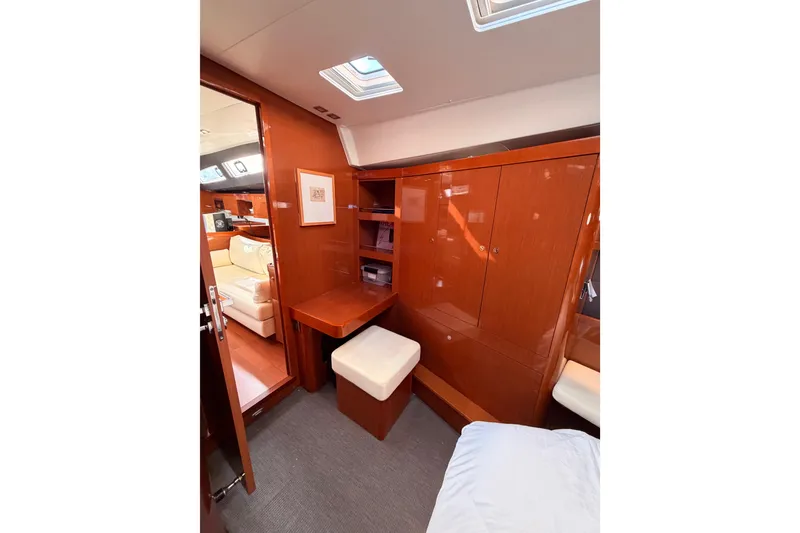 Slide: The Image of Luxurious interior of 2015 Beneteau Oceanis Yacht 60 with wooden cabinetry and seating. - 89