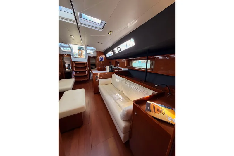 Slide: The Image of Luxurious interior of 2015 Beneteau Oceanis Yacht 60 with elegant seating and wood finishes. - 90
