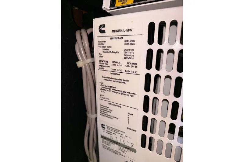 Slide: The Image of Cummins generator panel on a 2015 Beneteau Oceanis Yacht 60. - 93