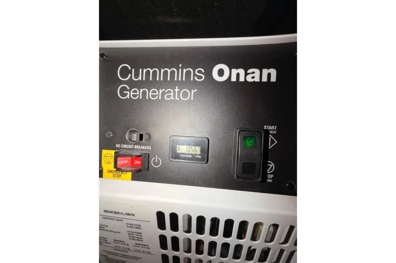 Slide: The Image of Cummins Onan generator control panel on 2015 Beneteau Oceanis Yacht 60. - 97