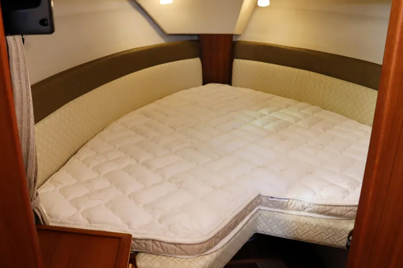 Slide: The Image of Cozy cabin bed in 2021 Ranger Tugs R-27 boat interior. - 19
