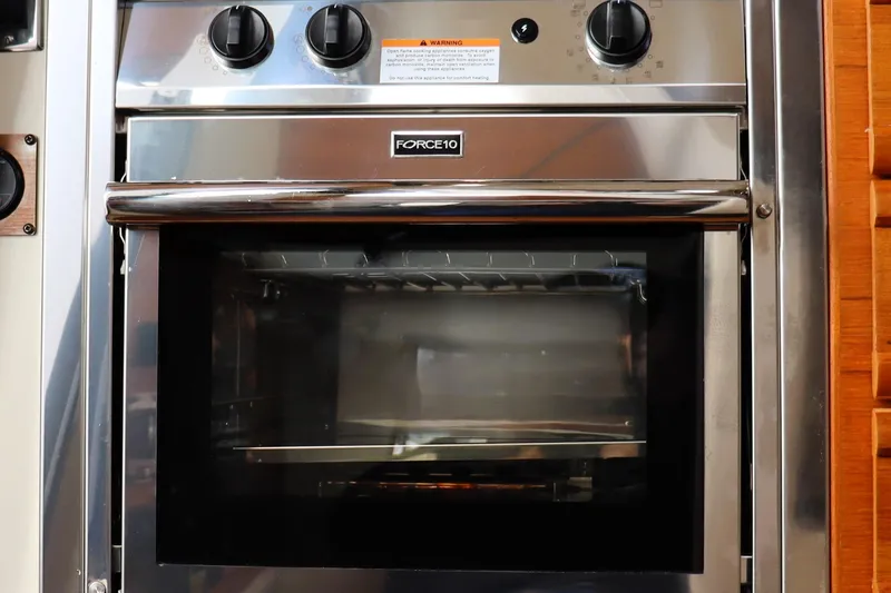 Slide: The Image of Stainless steel oven in 2021 Ranger Tugs R-27 boat kitchen. - 22