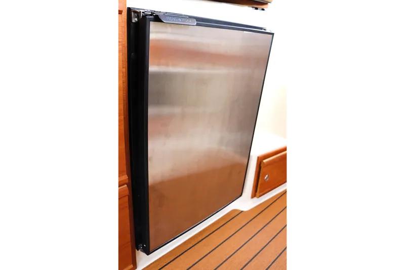 Slide: The Image of Stainless steel refrigerator in 2021 Ranger Tugs R-27 boat interior. - 25