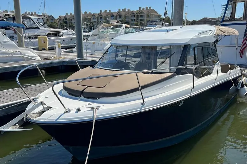 The Image of 2017 Jeanneau Merry Fisher 795 docked at marina, showcasing sleek design and modern features. - 0